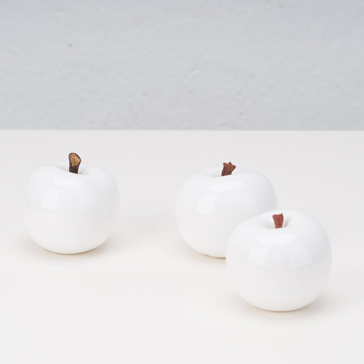 Set of 3 white ceramic apples by artist Lisa Pappon