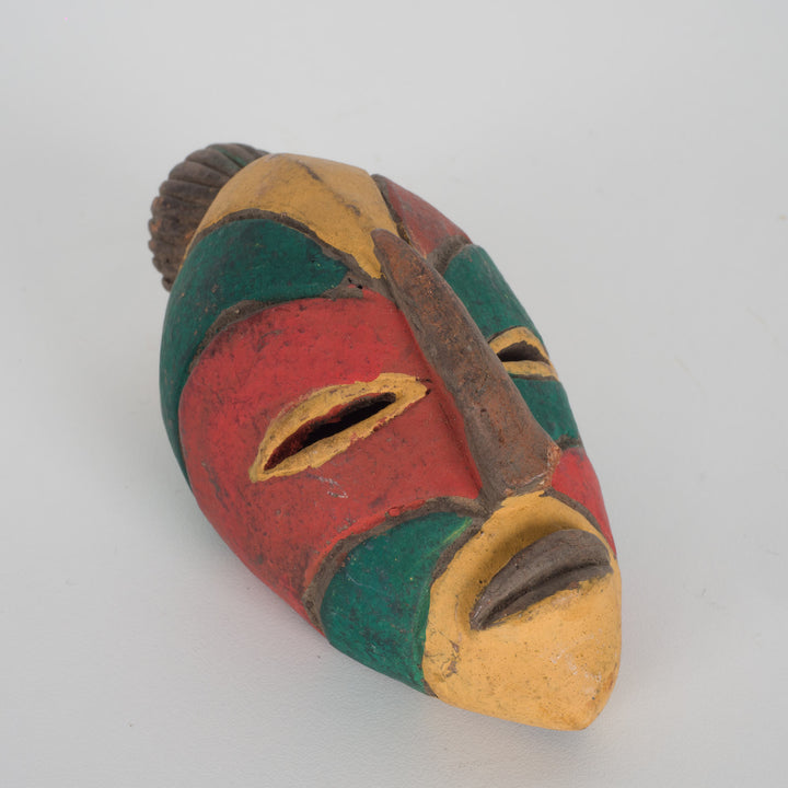 Small African decorative mask – green, red and yellow