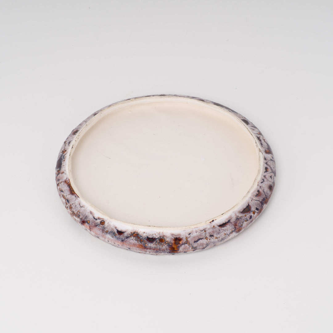 Cheerful round vintage ceramic cover with flowers
