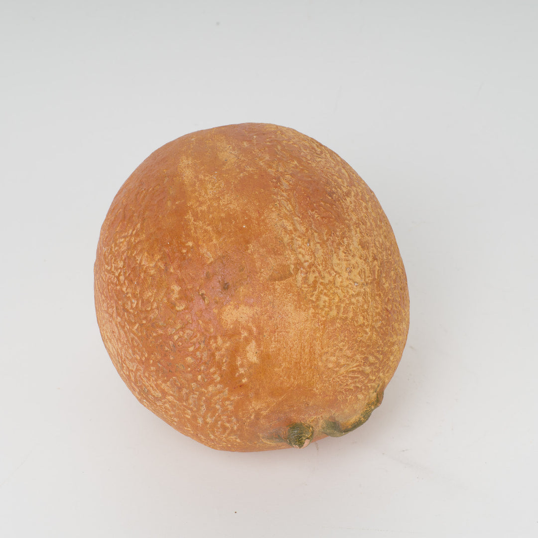 Decoratieve sculptuur van een citrusvrucht – steen of gips – 15 x 12 x 11 cm