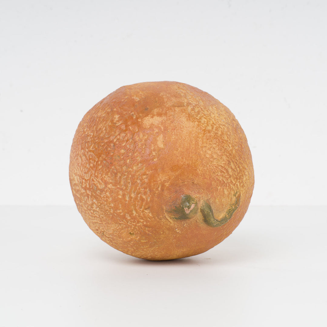 Decoratieve sculptuur van een citrusvrucht – steen of gips – 15 x 12 x 11 cm