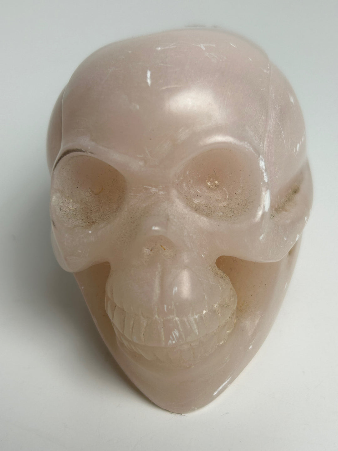 Sculptuur – Schedel in roze calciet | 15 x 5,5 x 7 cm
