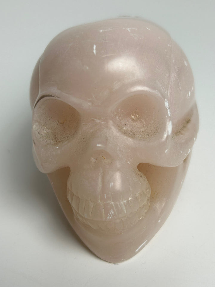 Sculptuur – Schedel in roze calciet | 15 x 5,5 x 7 cm