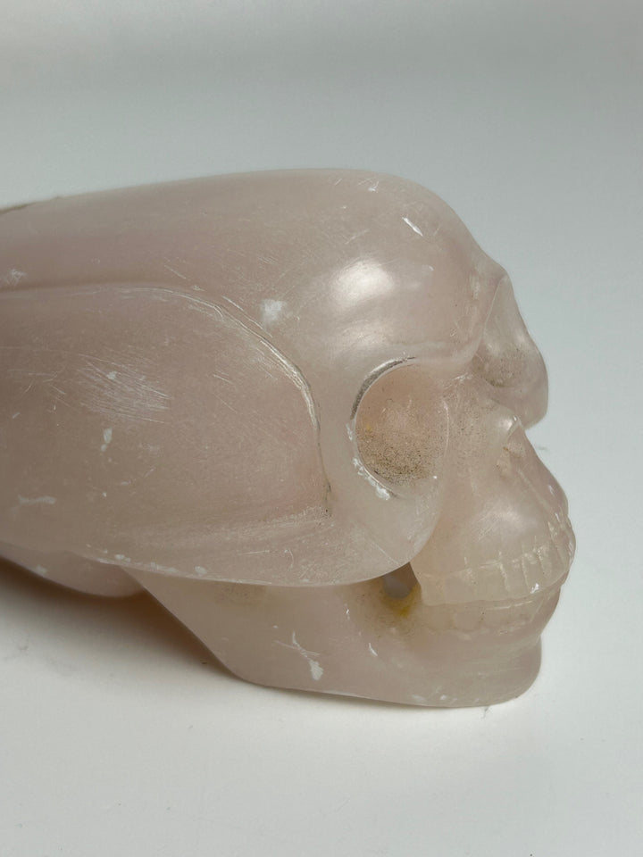 Sculptuur – Schedel in roze calciet | 15 x 5,5 x 7 cm