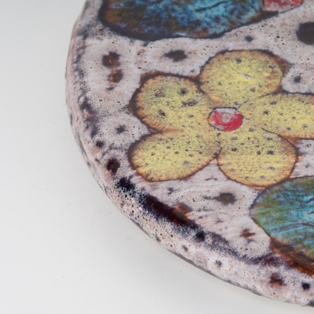 Cheerful round vintage ceramic cover with flowers