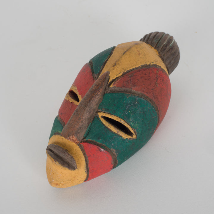Small African decorative mask – green, red and yellow
