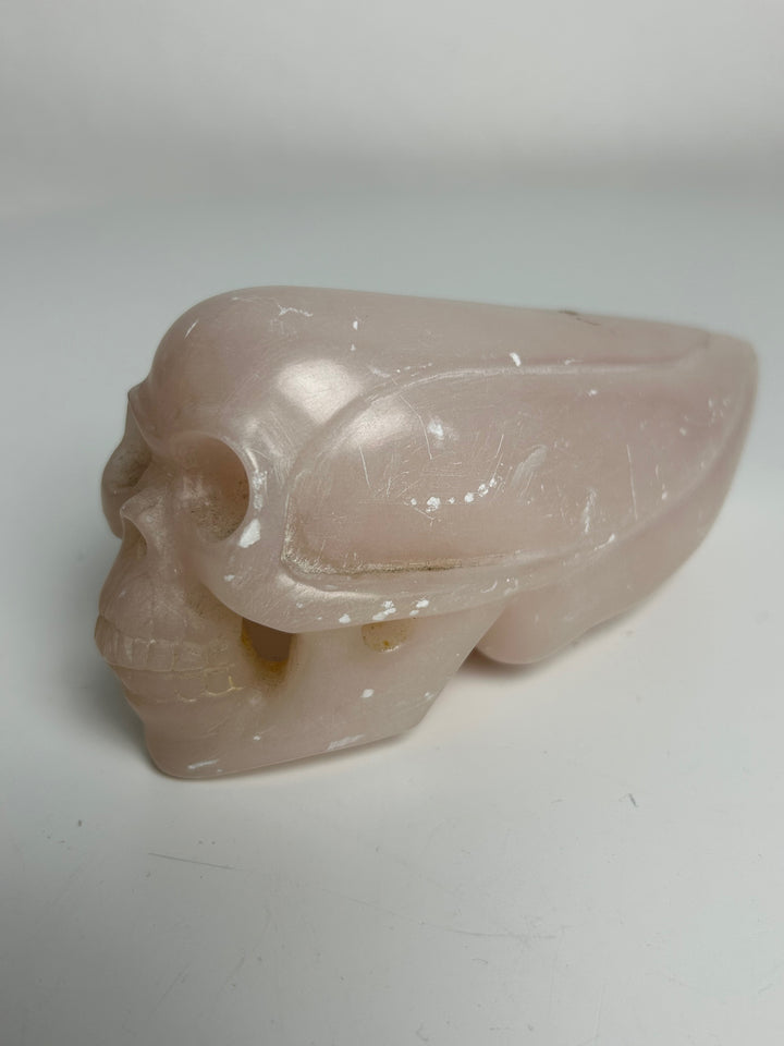 Sculptuur – Schedel in roze calciet | 15 x 5,5 x 7 cm