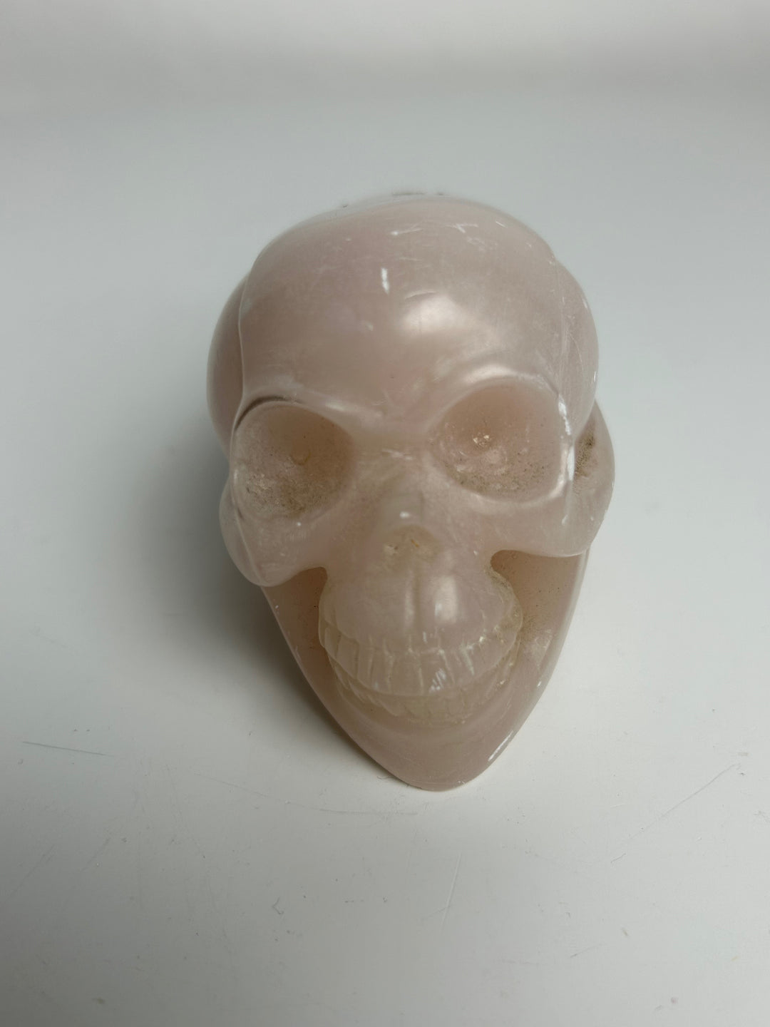 Sculptuur – Schedel in roze calciet | 15 x 5,5 x 7 cm