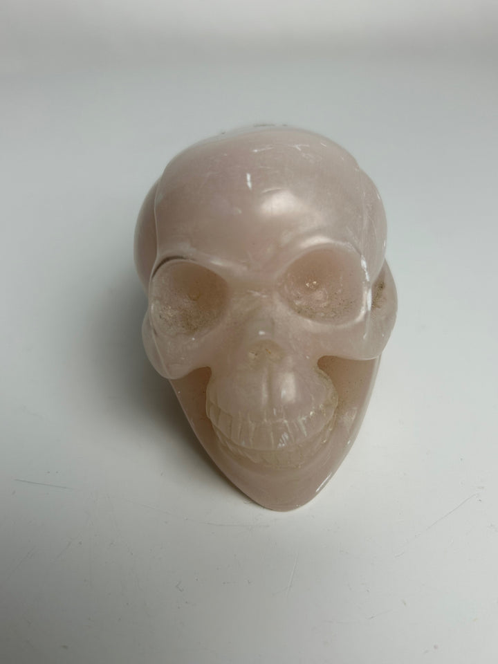 Sculptuur – Schedel in roze calciet | 15 x 5,5 x 7 cm