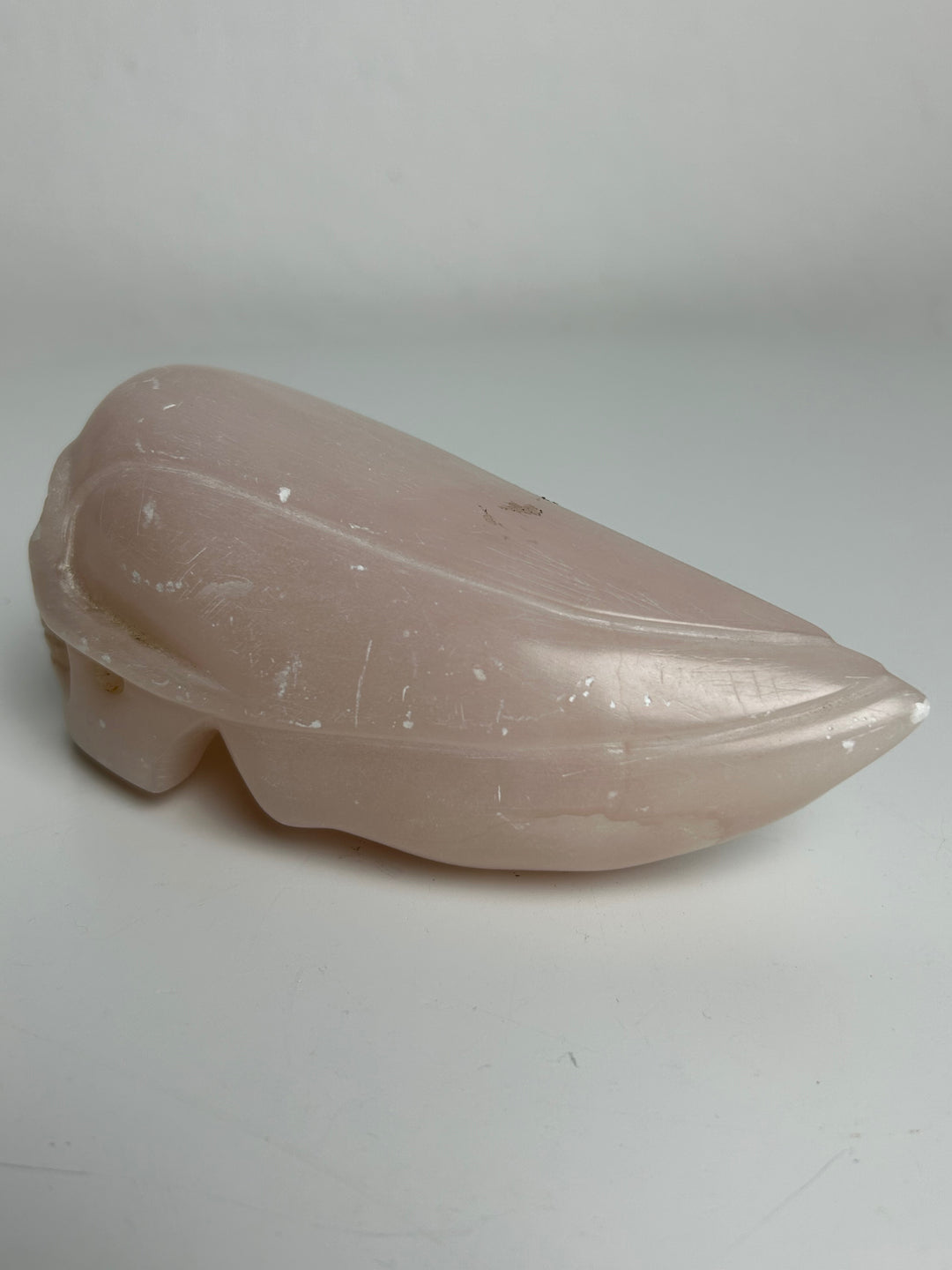 Sculptuur – Schedel in roze calciet | 15 x 5,5 x 7 cm