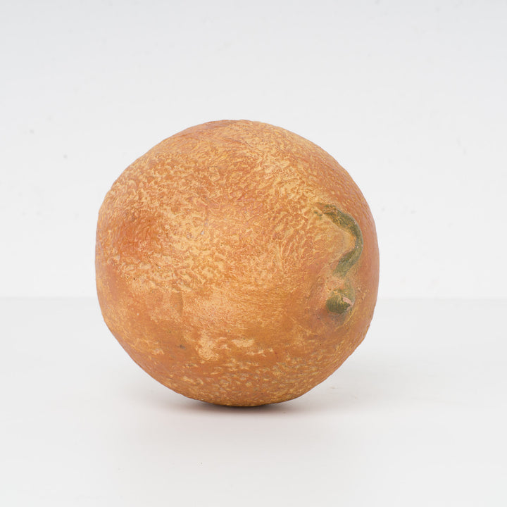 Decoratieve sculptuur van een citrusvrucht – steen of gips – 15 x 12 x 11 cm