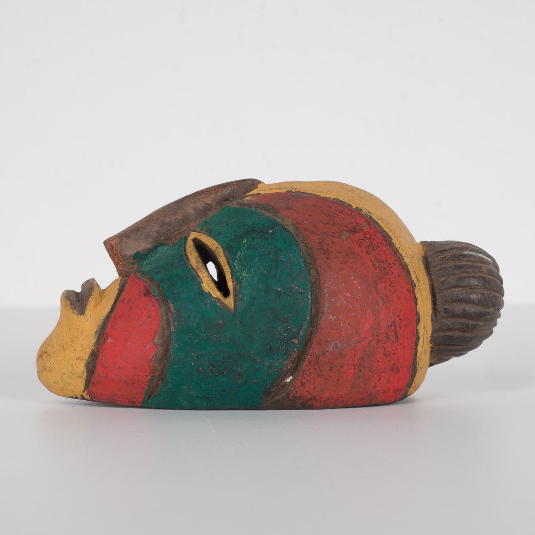 Small African decorative mask – green, red and yellow