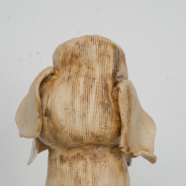 Playful image of a dog in clay