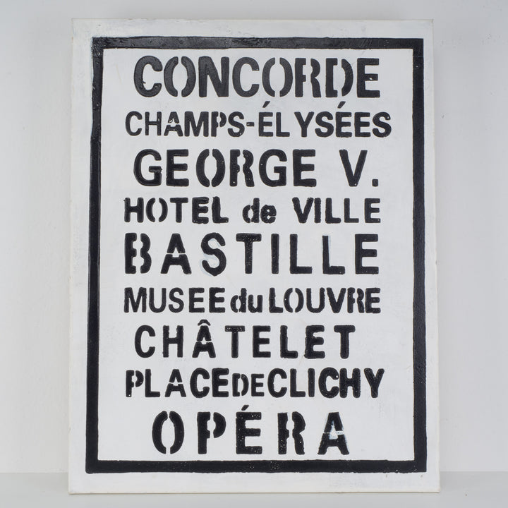 Black and white print with Parisian street names and famous places