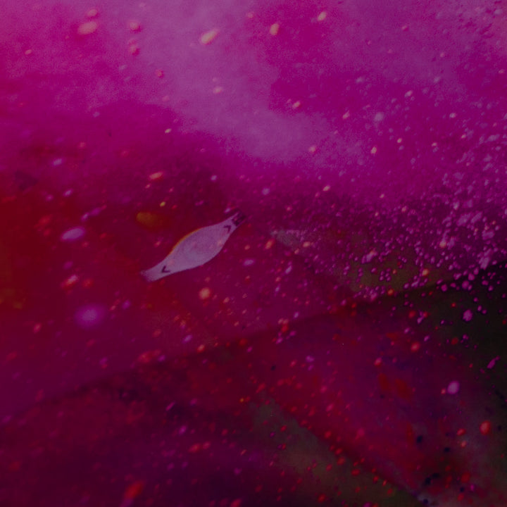 Beautiful photo of a young woman on glass in pink