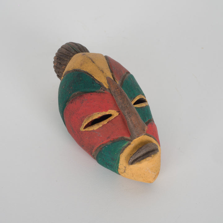 Small African decorative mask – green, red and yellow