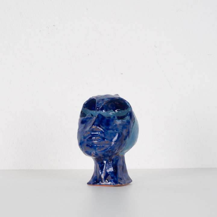 Ceramic face in blue glaze