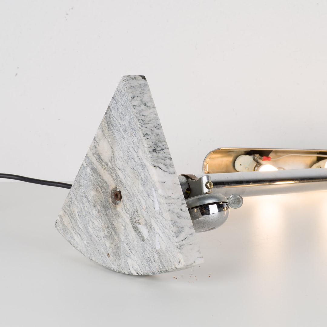 Fun metal table lamp with bicycle bell on a marble base.