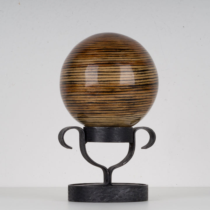 Decorative lacquered ball on metal stand