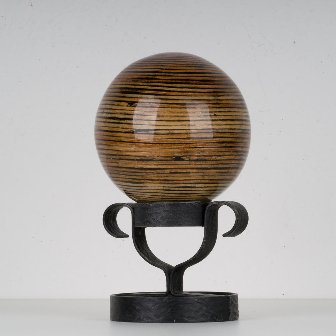 Decorative lacquered ball on metal stand