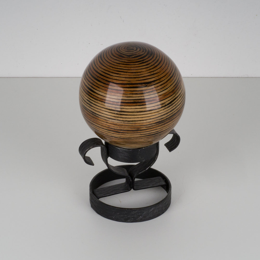 Decorative lacquered ball on metal stand