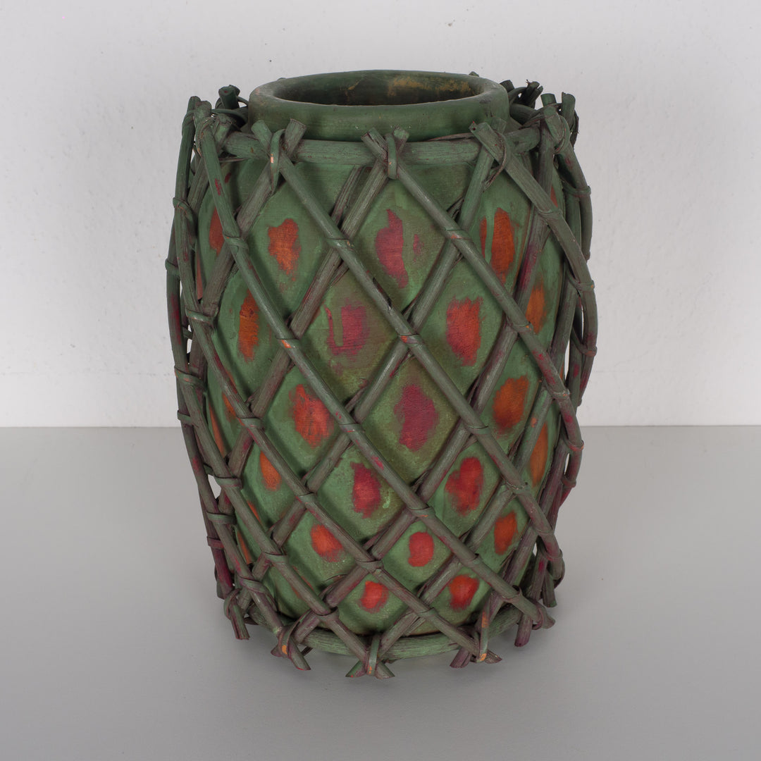 Authentic terracotta vase with wooden wickerwork