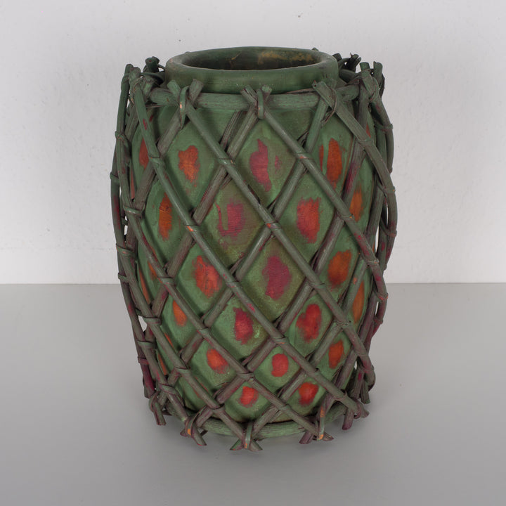 Authentic terracotta vase with wooden wickerwork