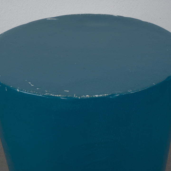 Round stool in polyester in petrol blue color