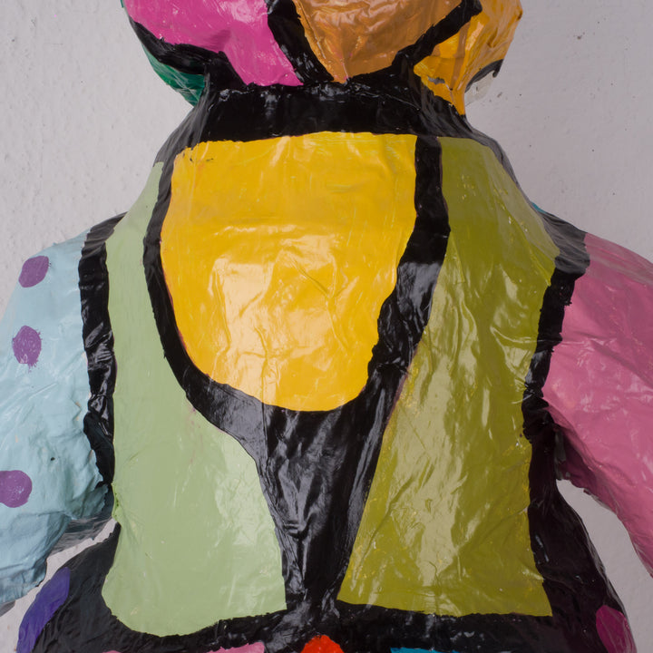 Large colorful statue of a doll in papier mache