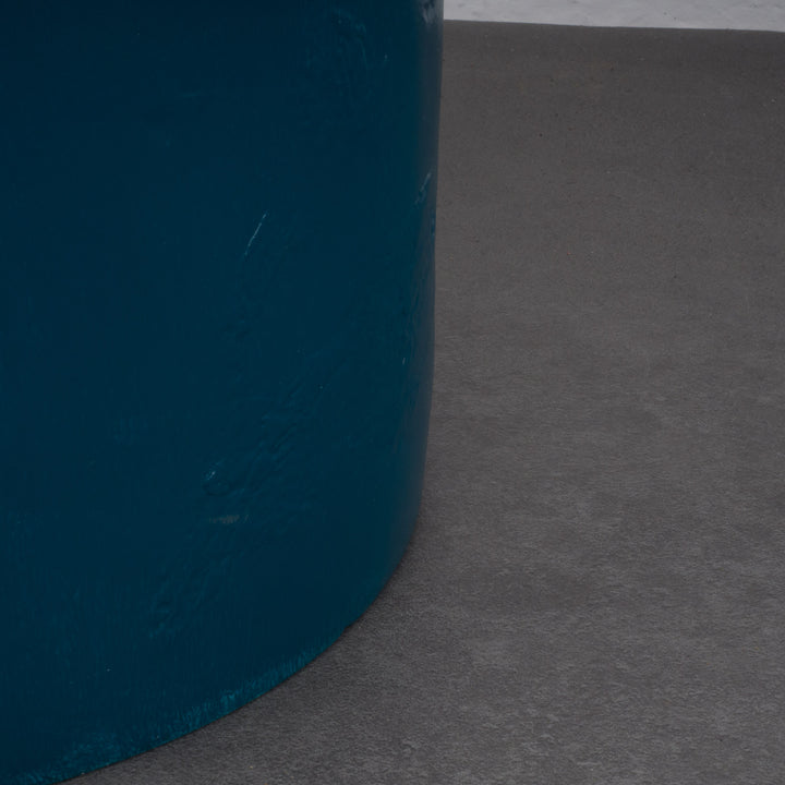 Round stool in polyester in petrol blue color