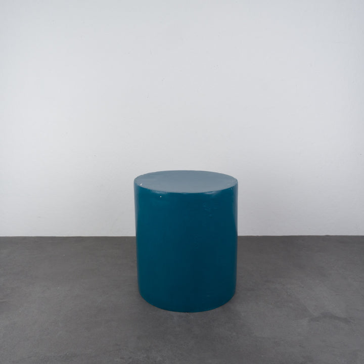 Round stool in polyester in petrol blue color