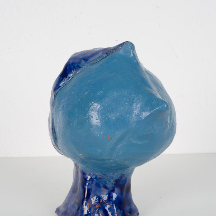 Ceramic face in blue glaze