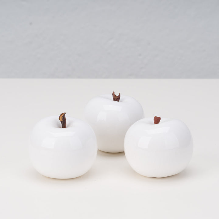 Set of 3 white ceramic apples by artist Lisa Pappon