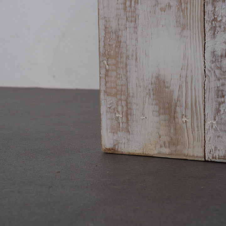 Whitewashed wooden base made of planks