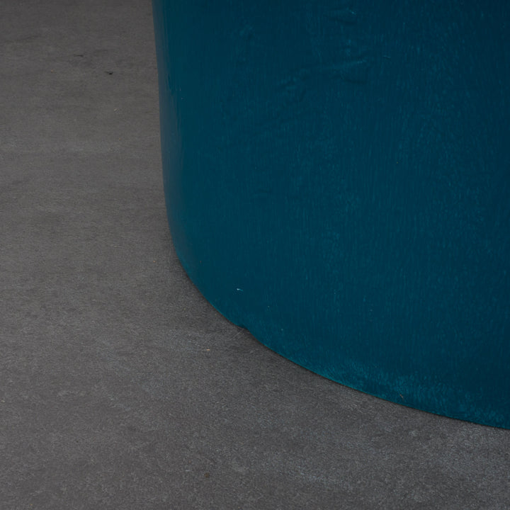 Round stool in polyester in petrol blue color