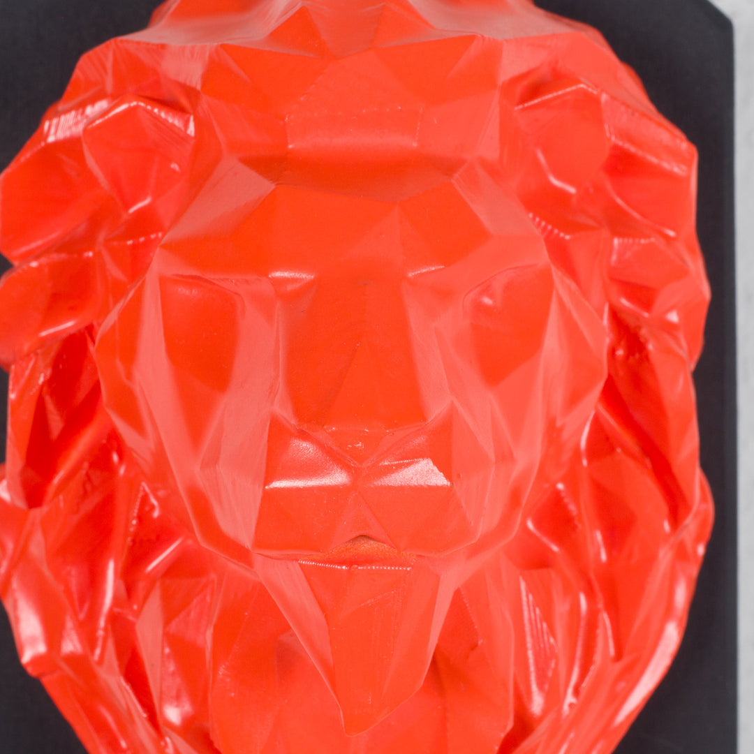 Artwork of a lion head in orange in resin